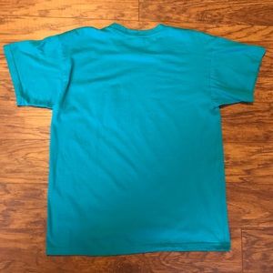Disney Tops - Epcot Flower and Garden Blue Pocket T-shirt Disney Tops - Epcot Flower and Garden Blue Pocket T-shirt